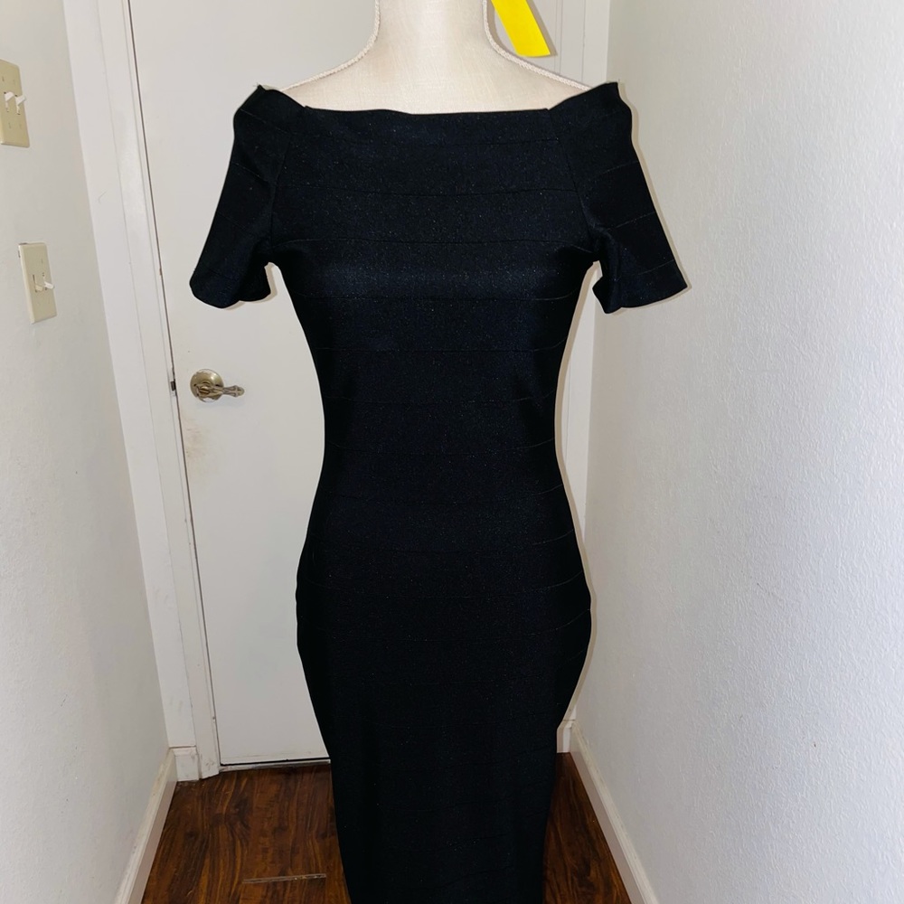 Black form fitting dress.